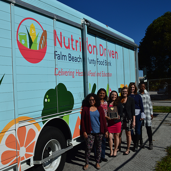 food bank truck with people posing outside