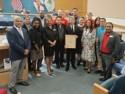 Members of the PBC HIV Care Council, the Community Services Department and the Ryan White Program accept the BCC Proclamation in the BCC Chambers.