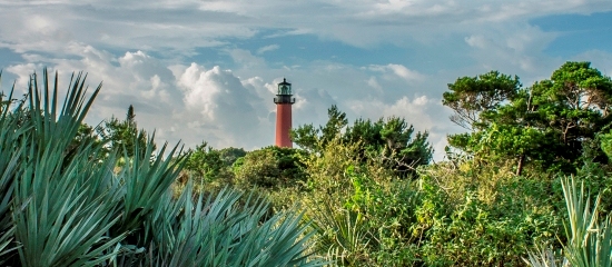 Picture of the iconic Jupiter Lighthouse as seen from Jupiter Inlet Lighthouse Outstanding Natural Area