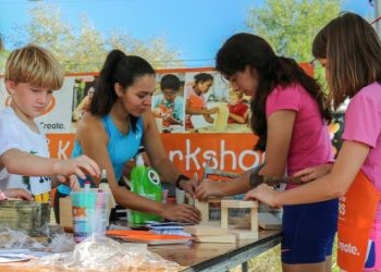 Kids building a craft with home depot supplies