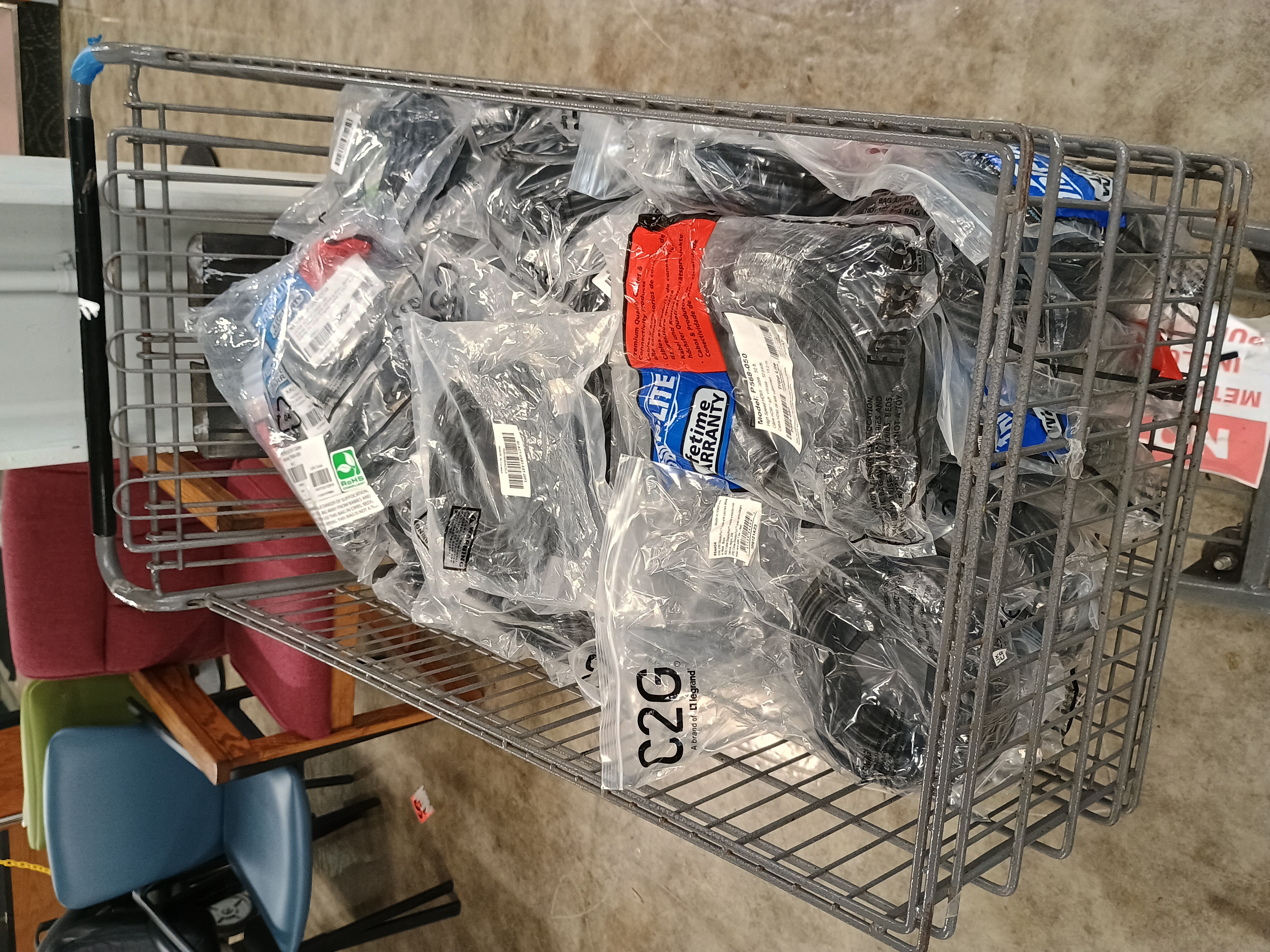 Metal shopping cart filled with computer cables.jpg