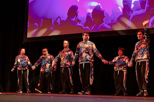 group of people performing on stage