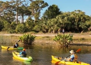 group kayaking at natural area